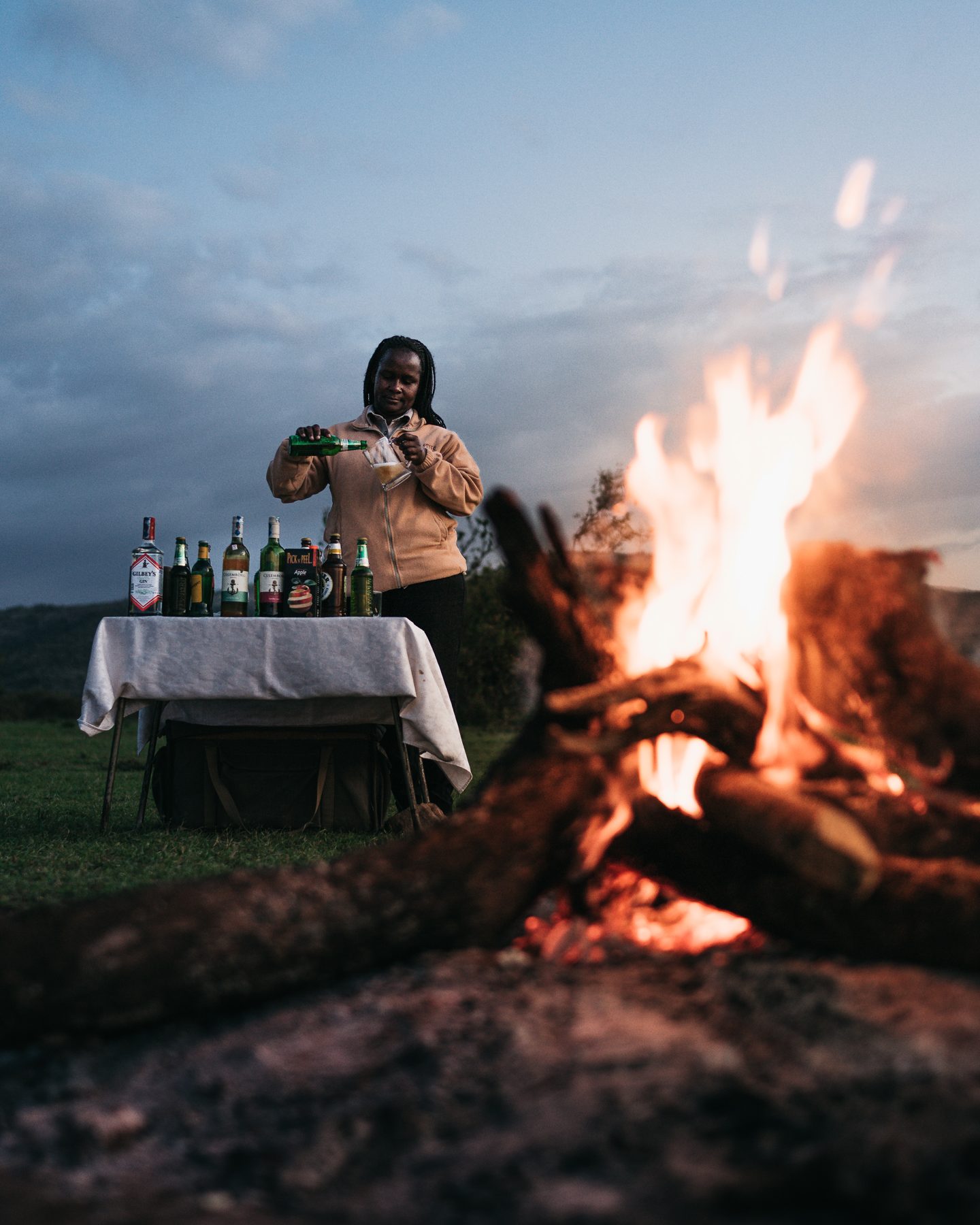 Sundowners around a bonfire in the bush